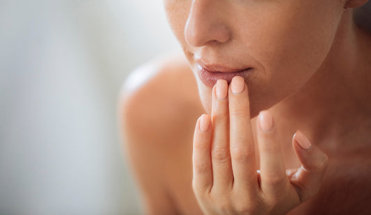 woman touching sensitive skin